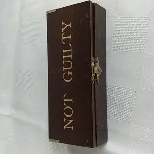 Brass gavel in a wooden box